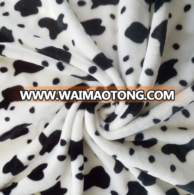 China suppliers cheap wholesale cow print flannel fabric for baby blanket