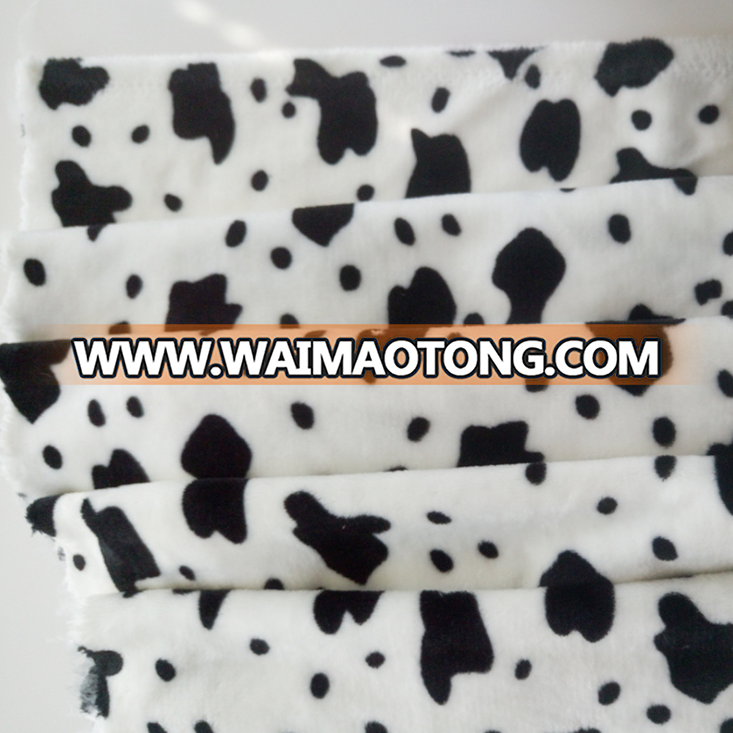 China suppliers cheap wholesale cow print flannel fabric for baby blanket